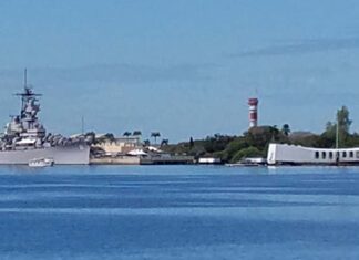 Pearl Harbor National Memorial A picture of the USS Arizona Memorial and the USS Missouri docked in Pearl Harbor.